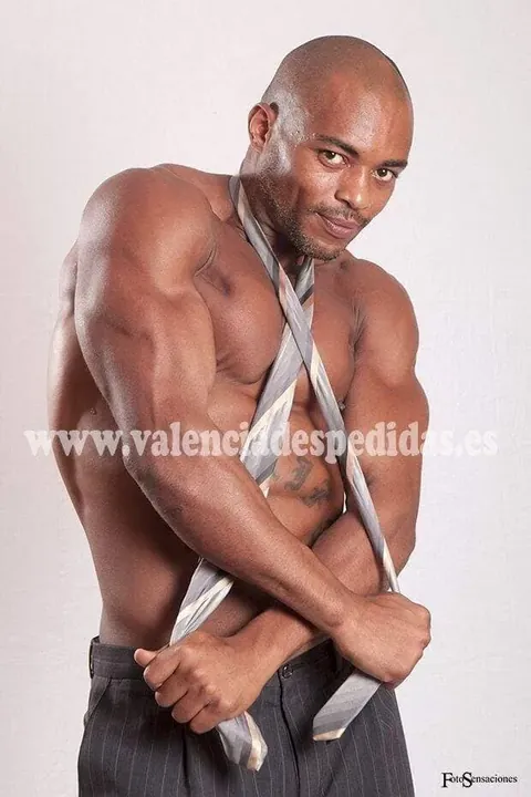 Cheeky butler option in Ibiza Male performer in Ibiza with a loosened tie and dark trousers for a cheeky butler show